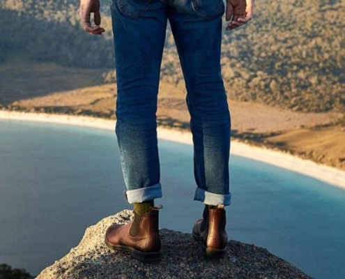 man standing on a rrock with Blundstone